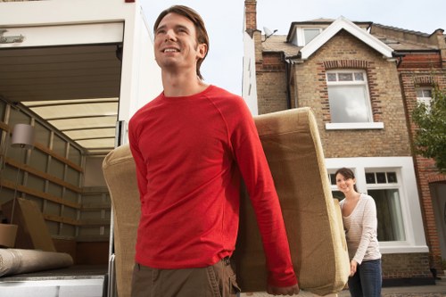 Professional movers handling furniture